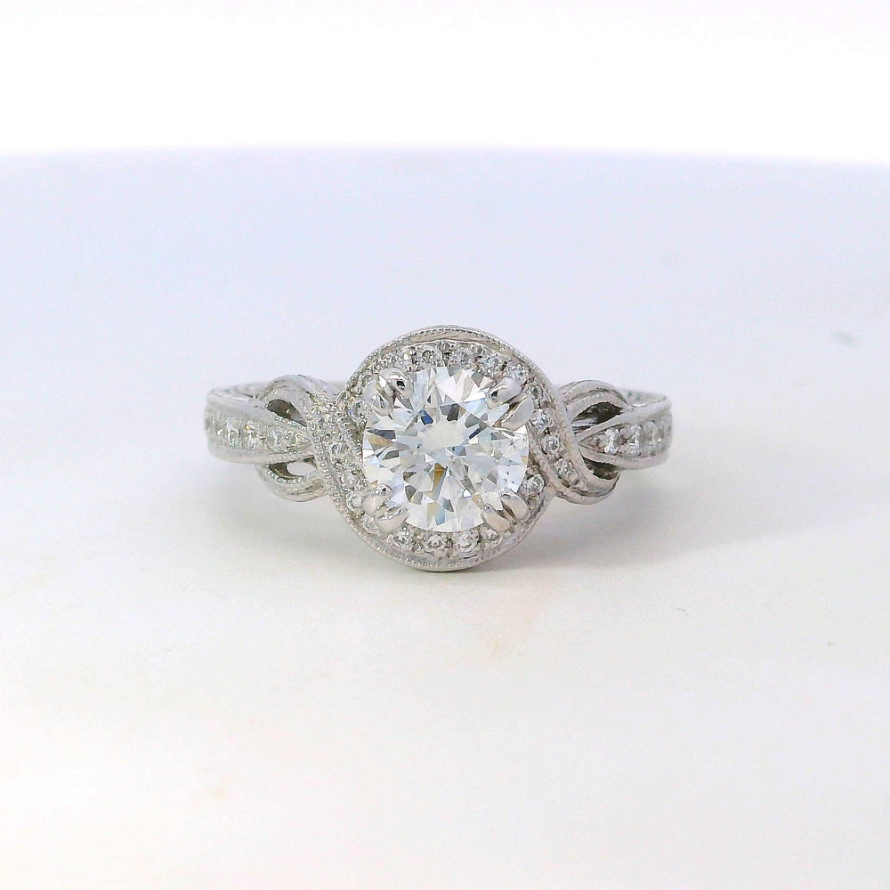 
                  
                    Previously Loved Round Natural Diamond Halo Twist Engagement Ring
                  
                