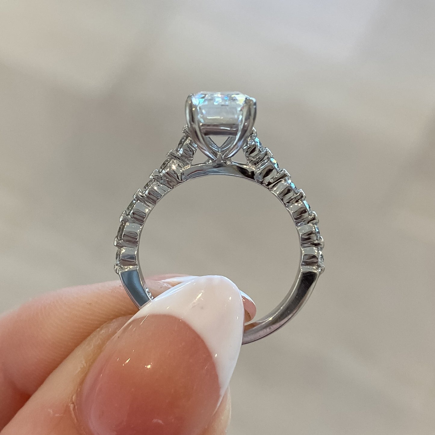 Aster Shared Prong Emerald Cut Moissanite Engagement Ring