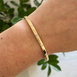 Diamond Station Accent Polished Gold Bangle Bracelet