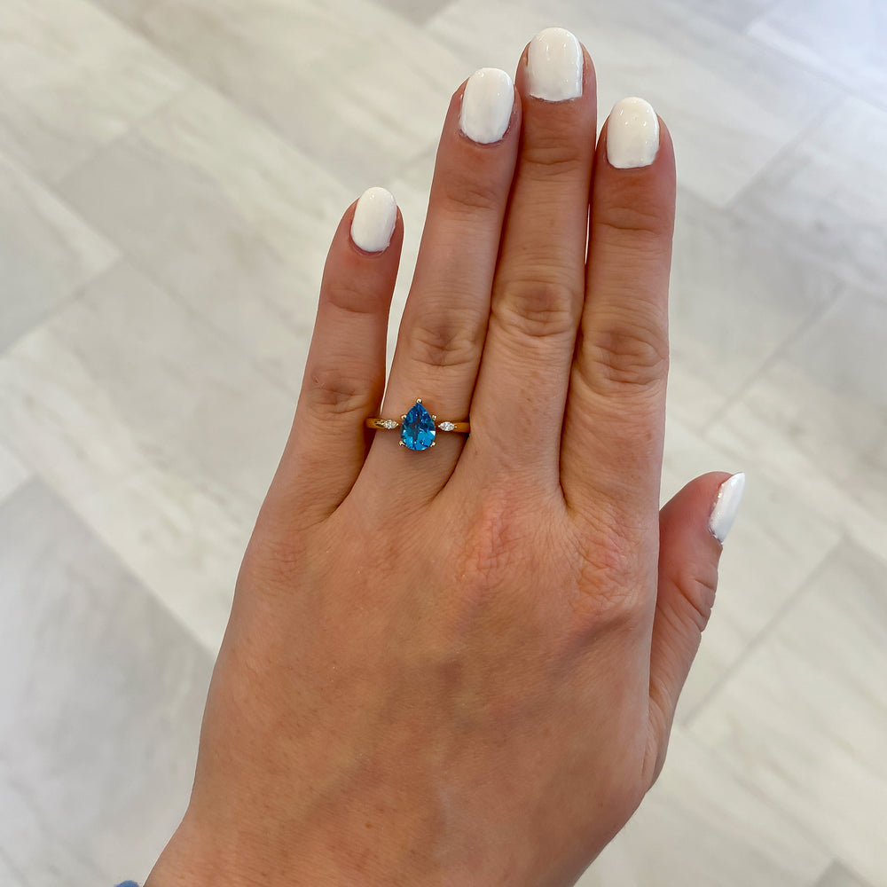 
                  
                    Pear Swiss Blue Topaz and Diamond Accent Ring
                  
                