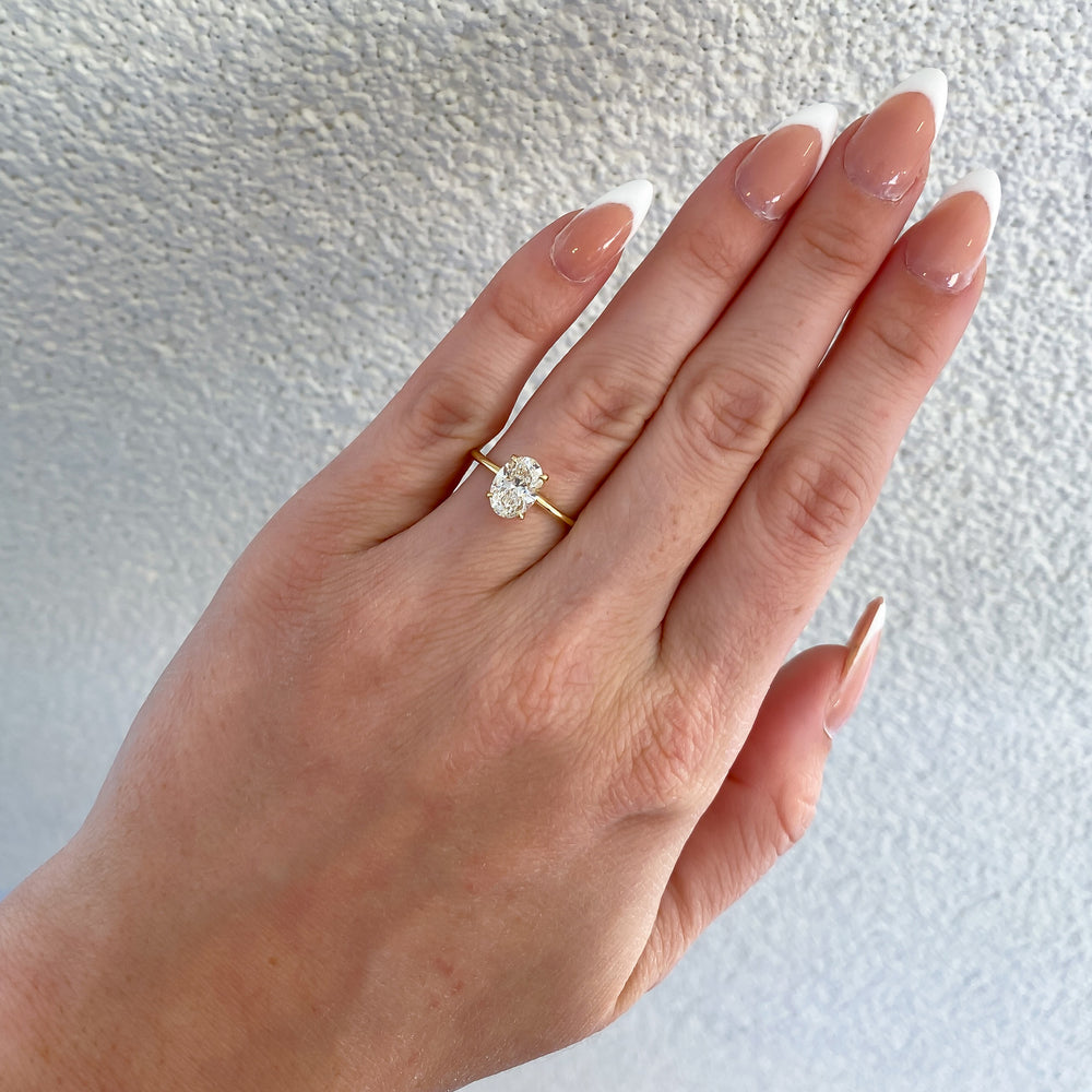 
                  
                    Azalea Natural Oval Diamond Hidden Halo Solitaire Engagement Ring, 1.30 CTTW - Carter's Collective Fine Jewelry
                  
                