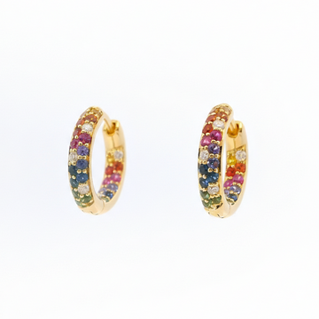 Gold hoop earrings with multicolored gemstones on a white background