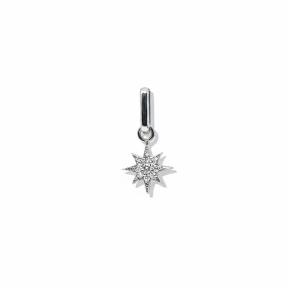 Silver star-shaped pendant with clear stones on a white background