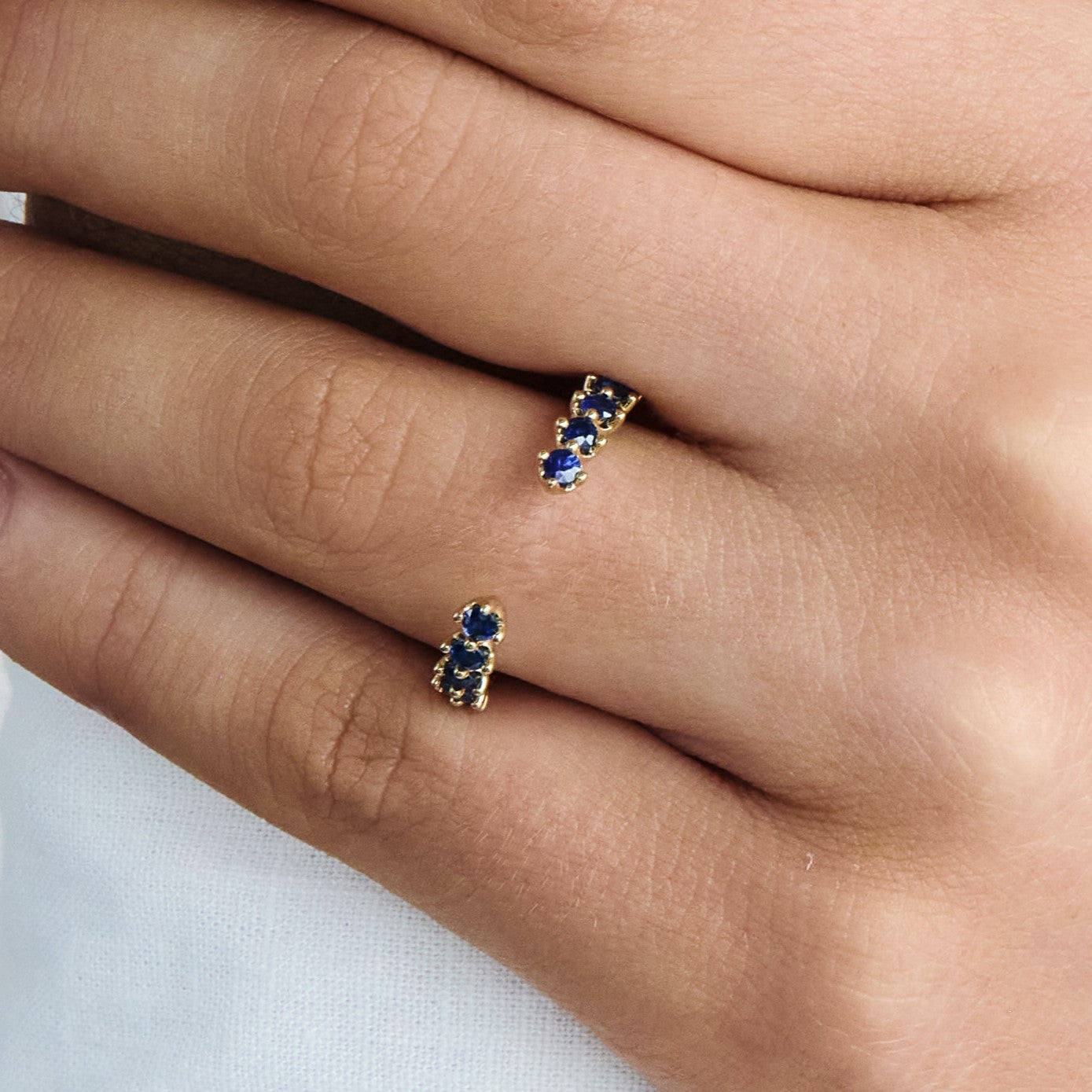 Open Posey Illusion Set Shared Prong Sapphire Gemstone Band, 0.53 CTTW - Carter's Collective Fine Jewelry